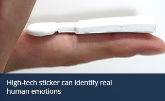 A sensor rests on an outstretched finger